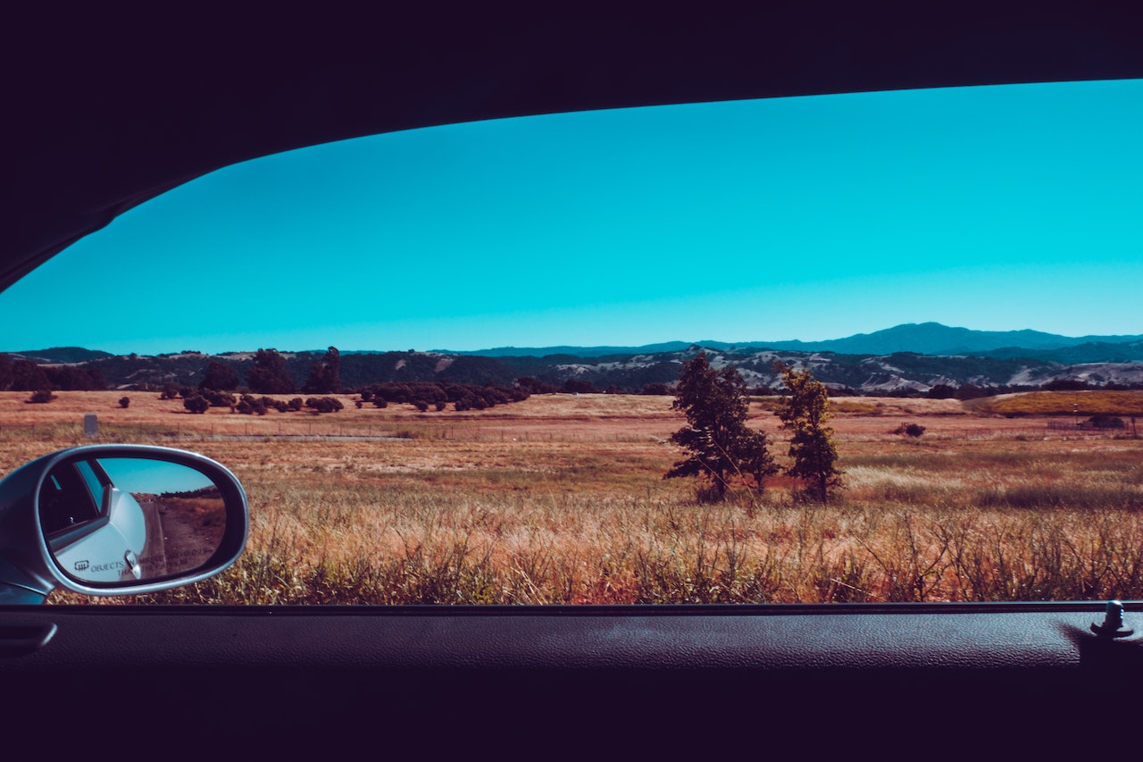 There are numerous emergency driving situations where you have to pull over. For example, when you see a paramedic or police vehicle approach you with an open siren and flashing lights. Knowing how to pull over in an emergency is a skill most drivers fear and worry about. In this article, we will talk about the steps you need to take if you are ever in such a situation. How to Identify a Case of an Emergency? In most cases, an emergency can be identified through a siren and flashing lights, whether from an ambulance, police car, firefighter truck, etc. Red is the most common color that is used to indicate emergencies. There are other colored lights that you may face, including blue, white, amber, and green. State statutes decide what departments can use these colors and where the lights can be mounted on a vehicle. Red Lights: The driver can only use red flashing lights in case of a real emergency, and they have to approach the destination as quickly as possible. Red lights are mounted on police cars, fire trucks, and other rescue squad vehicles. Blue lights: Police and other law enforcement cars normally use blue or a combination of red and blue lights. Rescue squad members and volunteer firefighters in some states may also use blue flashing lights in their private vehicles in response to an emergency. Yellow or amber lights: Construction vehicles generally use yellow lights to indicate caution, normally because these motor vehicles move slower than the rest of the traffic or sometimes block the traffic completely. School buses use a combination of red and yellow lights to alert the traffic about slowing down or stopping during loading and unloading. Green: Green light signifies an emergency in many US states and is generally used by a volunteer firefighter’s or fire chief’s car. It is also used by Homeland Security and other private security agencies that are required to guard government buildings. White: A tanker truck or school bus for fueling will normally use a flashing white light. What to do if you have to Pull Over in an Emergency Situation? Stay Calm When faced with an emergency, try to stay as calm as possible, or you may make rash and dangerous decisions. While it is important to stay calm, you must also take action quickly and wisely to avoid collisions with other cars or pedestrian accidents. Gauge the Situation Always gauge the situation first before making any quick and sudden movements. See if you need to slow down or pull over, and then do it correctly. If you are driving on a wide, quiet road, you may only have to signal your left indicator and start slowing down until the emergency vehicle passes you. If you are traveling on a high-speed road or a path without room to pull over, slow down as much as possible. If you are traveling in the left lane, pull over to the right lane until the traffic moves over. If you are driving in an intersection when you see an emergency vehicle, continue driving through it. Pull over to the right roadway, and stop. Stay there until the emergency vehicle has driven away. Don’t be hasty, and watch for other emergency vehicles as well. Keep your foot on the brake so the lights can alert the emergency vehicle driver that you have stopped. Never pull over in the middle of the road if you hear an emergency vehicle approaching, or it could result in severe crashes. The NHTSA recommends that you stop and look for more than one emergency vehicle approaching when you hear a siren. Never race behind an emergency vehicle to run a red light. Check your Mirrors Even in an emergency, you must respect the road safety rules. Make sure to check your surrounding areas in all the mirrors and look for any blind spots before making a decision. Avoid merging back into the traffic right after pulling over for an emergency vehicle. Before you do so, study the surroundings carefully to see if the roads are clear. Turn off the Music Driving with some cool tunes is fine, but if you think you hear the wails of a siren, quickly turn off the music box. This will allow you to observe how far away the emergency vehicle is and give you plenty of time to process the situation and react accordingly. Respect the Law Emergency vehicle drivers are permitted to break certain laws in certain situations since they have been trained appropriately. As a driver, you should always respect the law, no matter how frustrating it gets. Do not commit a driving offense, or you can quickly end up with a fine and poor driving record, such as running a red light because you were nervous. Do not go against the law to help emergency drivers pass through since that is not expected or required of you. Do what you can to help without breaking any rules or traffic laws. Leave Room for Overtaking Most emergency vehicles are substantially bigger than the average car, requiring more space to safely overtake. Moreover, give plenty of space if you have to overtake a parked emergency vehicle since they may have to rush a suspect or patient into the vehicle while you are passing. The rule of thumb is to stay at least 500 feet behind emergency vehicles. Final Thoughts Being in an emergency driving situation can be scary and overwhelming, so many drivers struggle with it. With the tips mentioned above, you can safely maneuver your vehicle and make way for the emergency vehicle. Make sure to follow the traffic laws in any situation. If you are ever involved in a road injury due to pulling over in an emergency, don’t panic. Call 911 immediately and then contact a reputable car accident lawyer in your area. These professionals are trained and experienced in providing legal representation and can make the process much quicker and more efficient. According to Koch & Brim, a lawyer can help you establish fault for a car accident, even in tricky situations like performing an emergency stop.